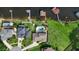 Stunning aerial view of lakeside homes, showcasing lush green lawns and private docks at 3604 Shell Cove Ln, Orlando, FL 32817