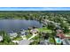 Scenic aerial view of a lakeside community with beautiful homes and lush greenery at 3604 Shell Cove Ln, Orlando, FL 32817