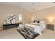 Bright bedroom featuring neutral tones, modern décor, and an ensuite bathroom at 3604 Shell Cove Ln, Orlando, FL 32817