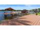 Charming boathouse with wooden deck, perfect for enjoying the peaceful lake view at 3604 Shell Cove Ln, Orlando, FL 32817