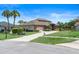 Suburban home featuring a manicured front lawn, a long driveway, and mature trees at 3604 Shell Cove Ln, Orlando, FL 32817