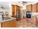 Well-equipped kitchen featuring stainless steel appliances, granite countertops, and tile flooring at 3604 Shell Cove Ln, Orlando, FL 32817