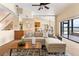 Spacious living room with a view into the kitchen and featuring neutral tones and a cozy carpet at 3604 Shell Cove Ln, Orlando, FL 32817