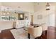 Bright living room with wood floors, modern furnishings, and view of the lake at 3604 Shell Cove Ln, Orlando, FL 32817