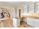 Well-lit office space with custom built-in shelving, granite countertops, and plenty of storage at 3604 Shell Cove Ln, Orlando, FL 32817