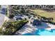 Aerial view of community amenities, including a pool, playground, parking area, and green space at 376 Willet Street Willet St, Haines City, FL 33844