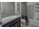 Bathroom featuring granite countertops, a built-in tub with shower, and tiled floors at 376 Willet Street Willet St, Haines City, FL 33844