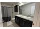 Bathroom featuring dual sinks, granite countertops, and a built-in shower with tub at 376 Willet Street Willet St, Haines City, FL 33844