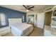 Bedroom featuring a large bed, sliding closet doors, and a navy accent wall at 376 Willet Street Willet St, Haines City, FL 33844