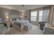 Main bedroom featuring neutral tones, a large bed, and natural light at 376 Willet Street Willet St, Haines City, FL 33844