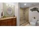Elegant bathroom featuring a vanity with granite countertop and a glass-enclosed shower at 4 Oceans West Blvd # 502D, Daytona Beach Shores, FL 32118