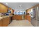 Spacious kitchen featuring stainless steel appliances, granite countertops, and an open floor plan at 4 Oceans West Blvd # 502D, Daytona Beach Shores, FL 32118