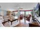 Bright living room featuring hardwood floors, stylish furniture, and a view from the balcony at 4 Oceans West Blvd # 502D, Daytona Beach Shores, FL 32118
