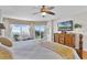 Comfortable main bedroom with a view, featuring a king-size bed and an en-suite bathroom at 4 Oceans West Blvd # 502D, Daytona Beach Shores, FL 32118