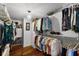 Walk-in closet with custom shelving and ample storage space for clothing and accessories at 4 Oceans West Blvd # 502D, Daytona Beach Shores, FL 32118