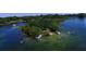 Aerial view of a lakeside community with boats enjoying a sunny day on the water at 4415 Raymar Dr, Orlando, FL 32839