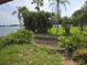 Landscaped backyard features lush greenery, water access and beautiful waterfront views at 4415 Raymar Dr, Orlando, FL 32839