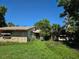 Charming single-story home with stone facade and mature landscaping at 4415 Raymar Dr, Orlando, FL 32839