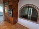 Kitchen showcasing stainless appliances with a brick archway to another room at 4415 Raymar Dr, Orlando, FL 32839
