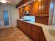 Kitchen with wooden cabinets and gas range at 4415 Raymar Dr, Orlando, FL 32839