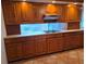 Kitchen with wooden cabinets and gas range at 4415 Raymar Dr, Orlando, FL 32839
