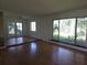 Living room boasting hardwood floors, a ceiling fan, and sliding glass doors at 4415 Raymar Dr, Orlando, FL 32839