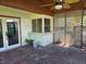 View of the brick patio featuring lattice and pass-through window at 4415 Raymar Dr, Orlando, FL 32839