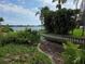 Waterfront property with a picturesque view of the water, lush foliage, and a private boat launch at 4415 Raymar Dr, Orlando, FL 32839