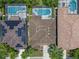 Rooftop view of several homes featuring private pools and solar panels at 5172 Oakbourne Ave, Davenport, FL 33837