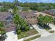 A high aerial view showcases this property, its landscaping, and neighborhood at 5172 Oakbourne Ave, Davenport, FL 33837