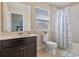 Bathroom with a single sink vanity, toilet, and bathtub with shower at 5172 Oakbourne Ave, Davenport, FL 33837