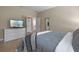 Bedroom featuring a dresser with TV and tiled floors at 5172 Oakbourne Ave, Davenport, FL 33837