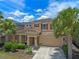 Charming two-story home with manicured landscaping and a two-car garage at 5172 Oakbourne Ave, Davenport, FL 33837