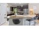 Spacious kitchen with granite countertops, stainless steel appliances, and dark wood cabinets at 5172 Oakbourne Ave, Davenport, FL 33837