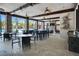 Outdoor lounge with seating, fans, and stone accents near the pool, perfect for relaxation at 5172 Oakbourne Ave, Davenport, FL 33837