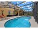 View of the backyard pool and patio, as well as the exterior of the two-story home at 5172 Oakbourne Ave, Davenport, FL 33837