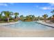 Community pool surrounded by lounge chairs and palm trees offering a resort-like experience at 5172 Oakbourne Ave, Davenport, FL 33837