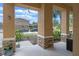 Covered porch featuring stone column bases and a view of the neighborhood street and exterior landscaping at 5172 Oakbourne Ave, Davenport, FL 33837