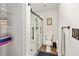 Modern bathroom featuring a glass-enclosed shower, wood-look flooring, and a neutral color palette at 5430 Nw 55Th Pl, Ocala, FL 34482