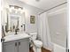 Bathroom featuring modern vanity, tiled shower, and neutral tones, offering a clean and inviting space at 5430 Nw 55Th Pl, Ocala, FL 34482