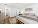 Bright bedroom with hardwood floors, white walls, and a well-lit entry to the closet at 5430 Nw 55Th Pl, Ocala, FL 34482