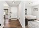 Bright foyer featuring wood floors with access to a bedroom and dining room at 5430 Nw 55Th Pl, Ocala, FL 34482