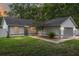Charming single-story home with well-maintained lawn, gray accents and a cozy, inviting entrance at 5430 Nw 55Th Pl, Ocala, FL 34482