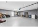 Spacious garage with painted walls, a door, and ample room for parking and storage at 5430 Nw 55Th Pl, Ocala, FL 34482