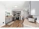 Modern kitchen with stainless steel appliances, gray cabinets, wood floors, and plenty of counter space at 5430 Nw 55Th Pl, Ocala, FL 34482