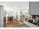 Open concept kitchen with wood floors open to the dining room and living room at 5430 Nw 55Th Pl, Ocala, FL 34482