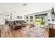 Inviting living room with hardwood floors and sliding doors that bring in natural light at 5430 Nw 55Th Pl, Ocala, FL 34482