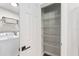 Pantry with shelving and laundry machines, adding practicality to the home at 5430 Nw 55Th Pl, Ocala, FL 34482
