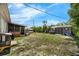 Large backyard with a playset, pool and storage shed at 565 S Floyd Cir, Deltona, FL 32725