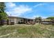 Sprawling backyard with a barbeque grill and an above-ground pool at 565 S Floyd Cir, Deltona, FL 32725